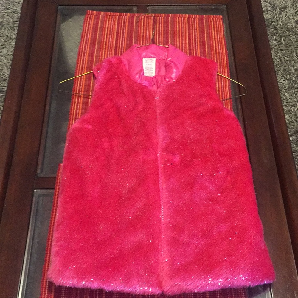 Pink fuzzy children’s sleeveless jacket
